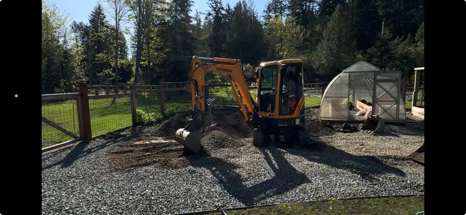 Before — mini excavator levelling and prepping the backyard