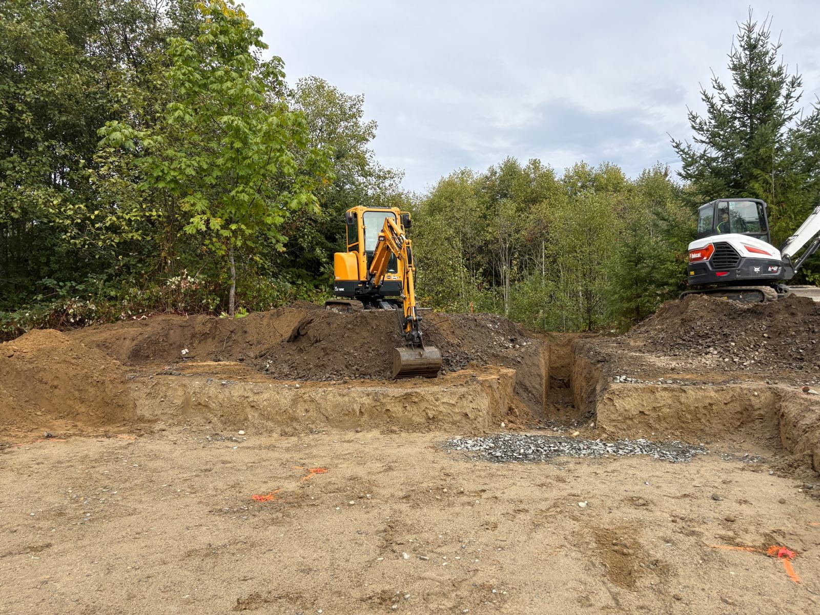 Mini excavator digging on a Vancouver Island job site