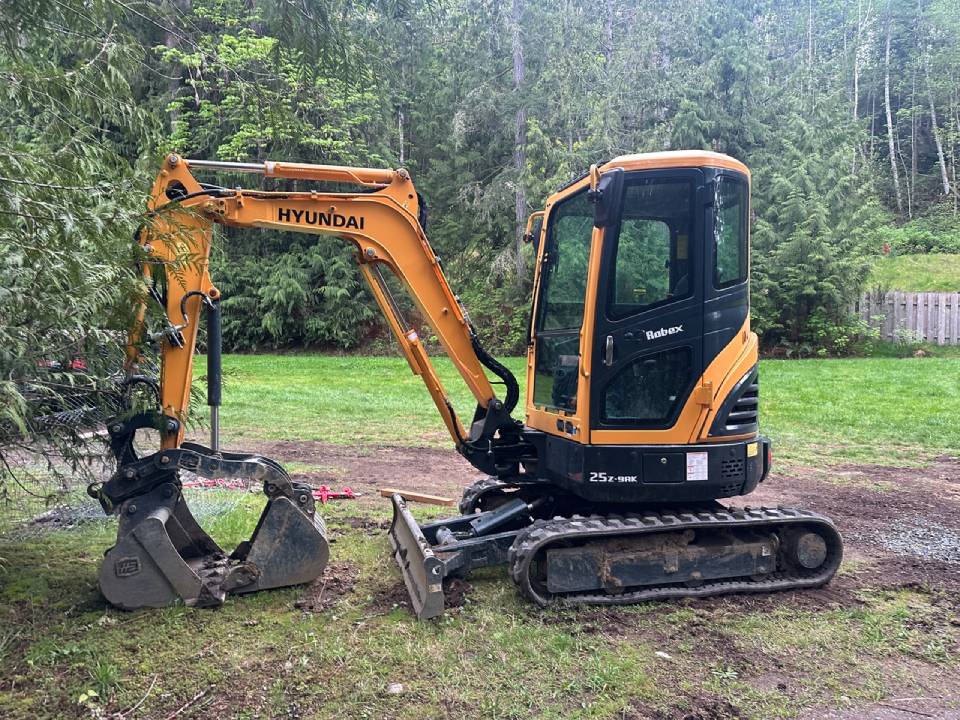 Mini excavation for deck footing preparation on Vancouver Island